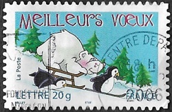 Ours blanc en luge et pingouins